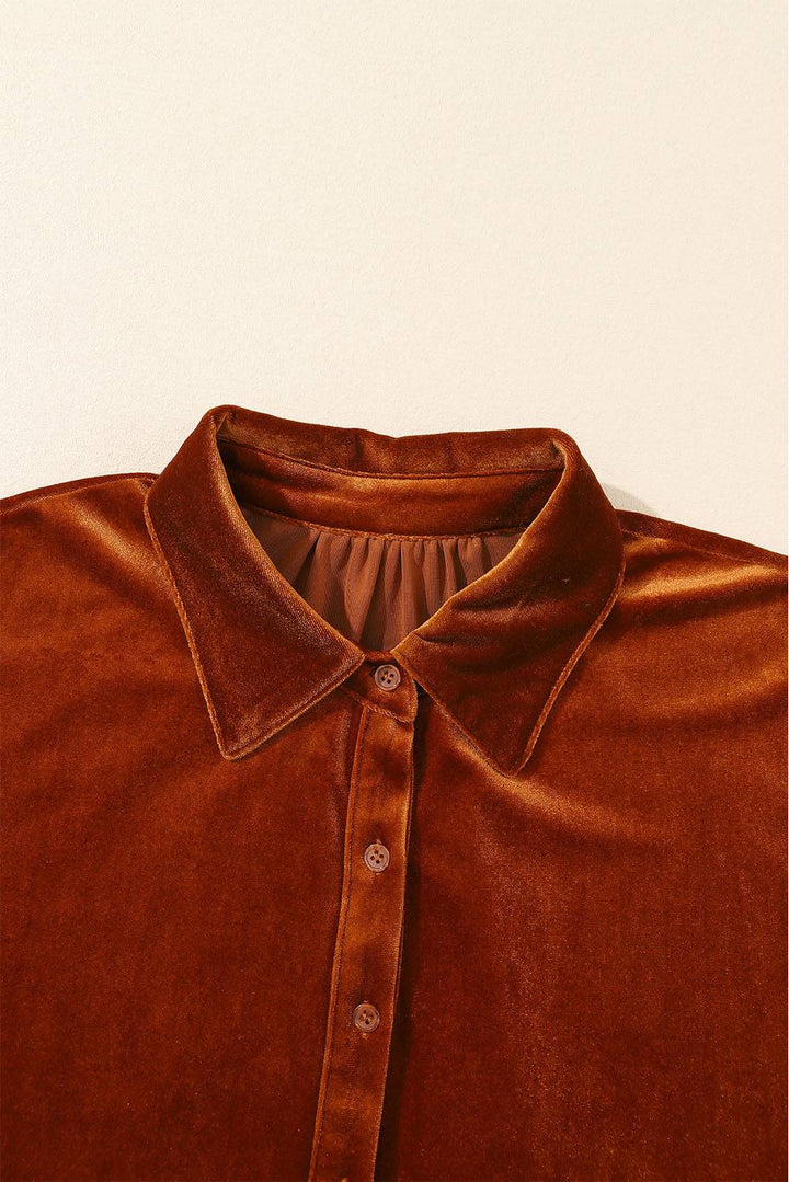 a close up of a brown shirt on a white background