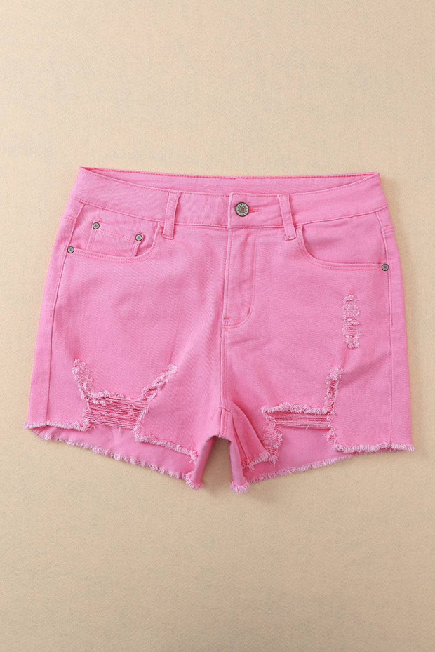 a pair of pink shorts with holes on them