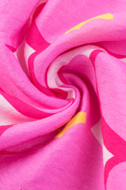 a close up of a pink and yellow fabric