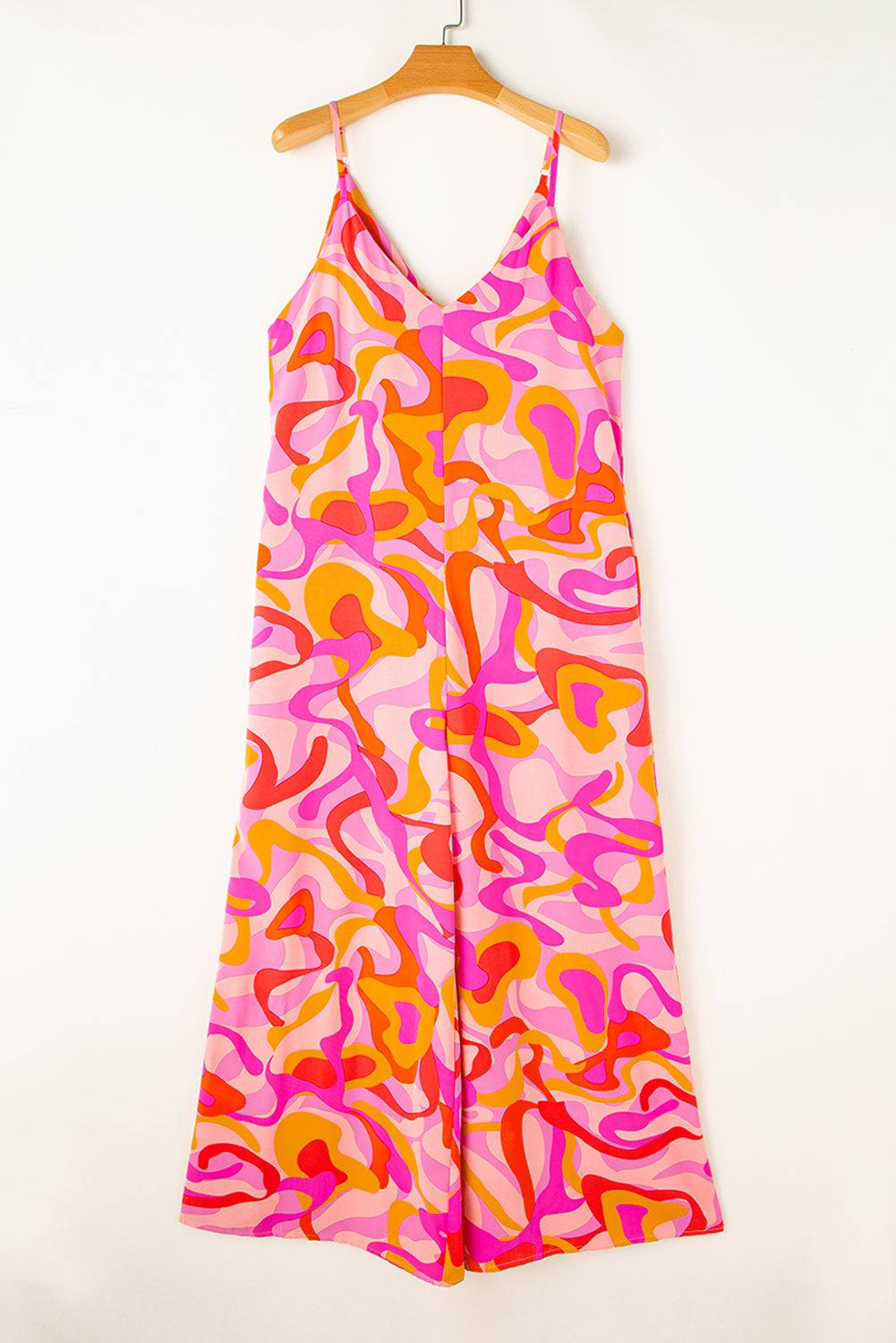 a pink and orange dress hanging on a hanger