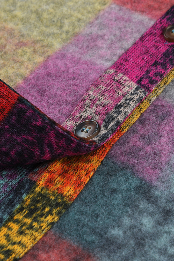 a close up of a multicolored blanket with buttons