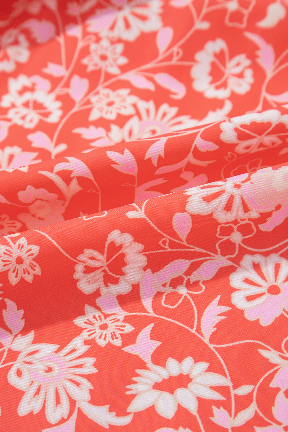 fabric close-up of Red Floral Print Tasseled Tied Sleeve Empire Waist Maxi Dress, featuring soft red floral print for summer comfort