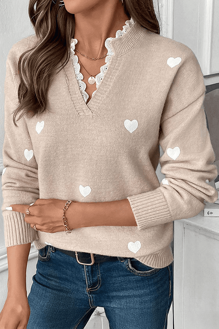Smoke Gray Heart Print Lace Splicing V Neck Valentines Sweater with white heart patterns and lace-trimmed neckline, styled with jeans.
