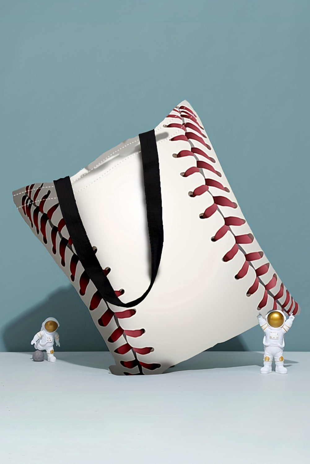 a white bag with a red and black baseball on it