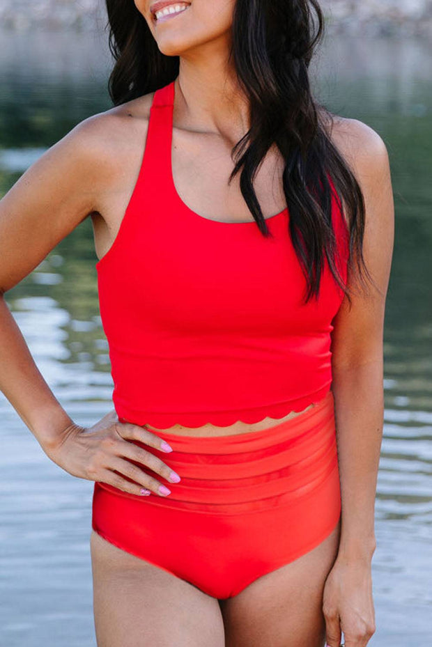a woman in a red swimsuit posing for a picture