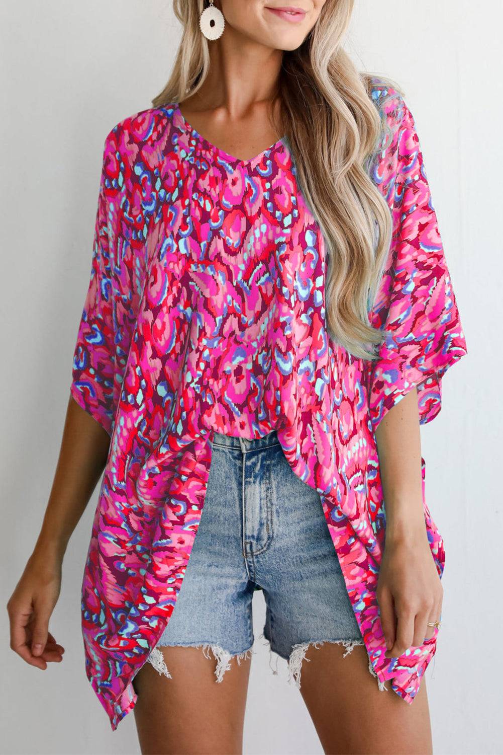 Close-up of Pink Abstract Print V Neck Half Sleeve Loose Fit Tunic Blouse showing vibrant colors and relaxed fit, ideal for vacation wear.