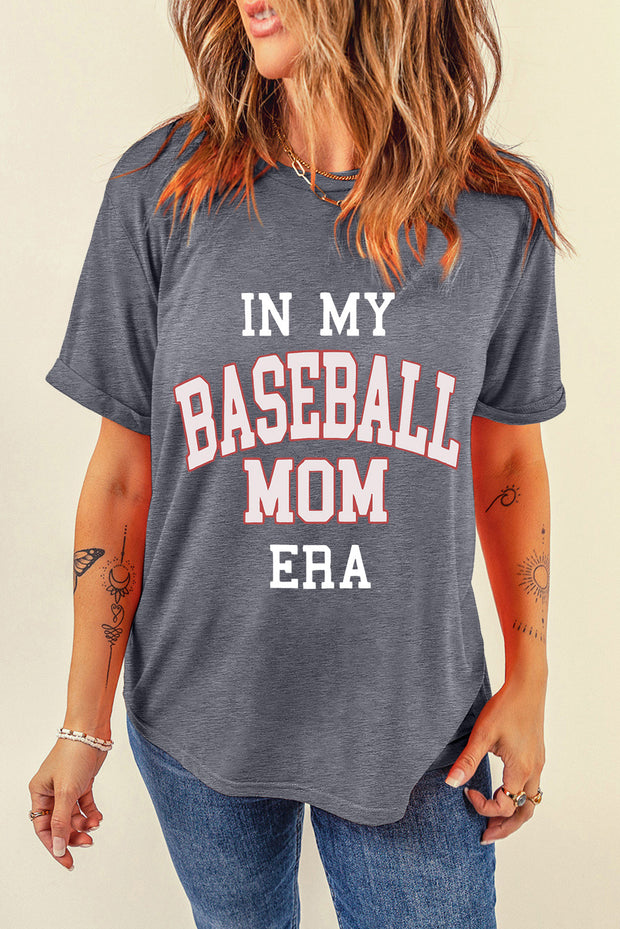 a woman wearing a baseball mom t - shirt