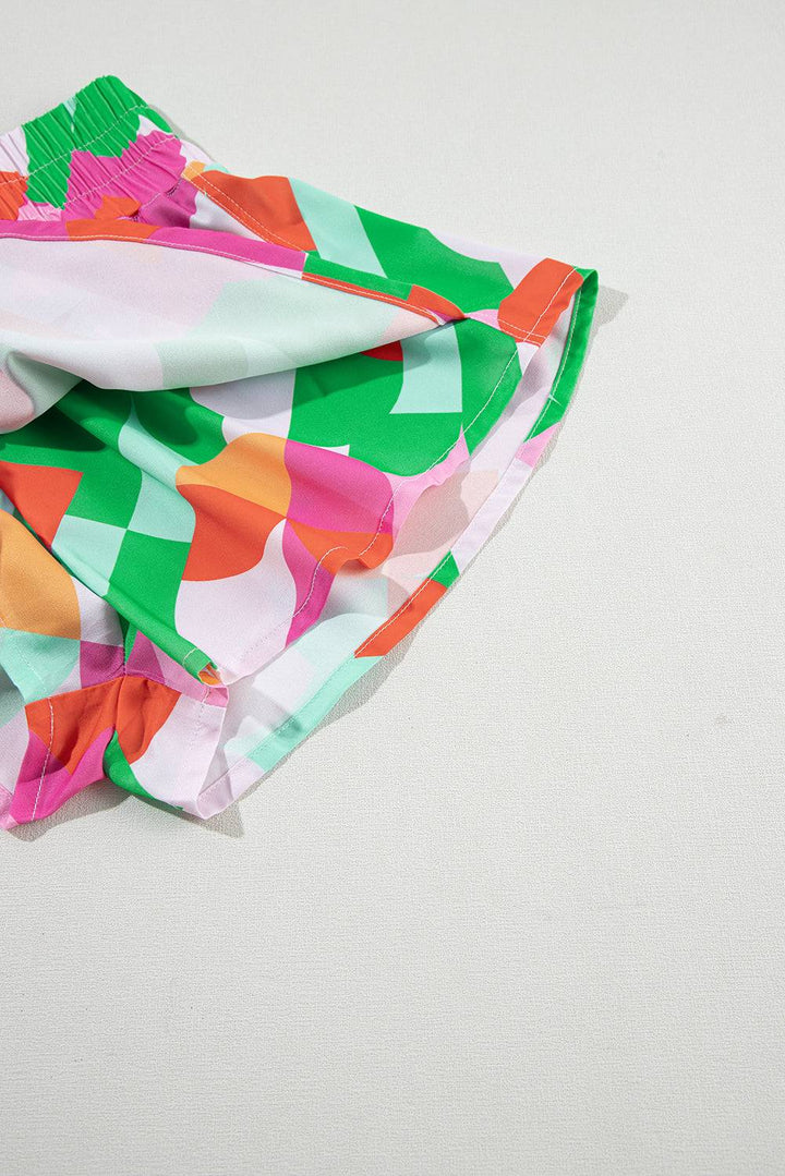 a colorful scarf laying on a white surface
