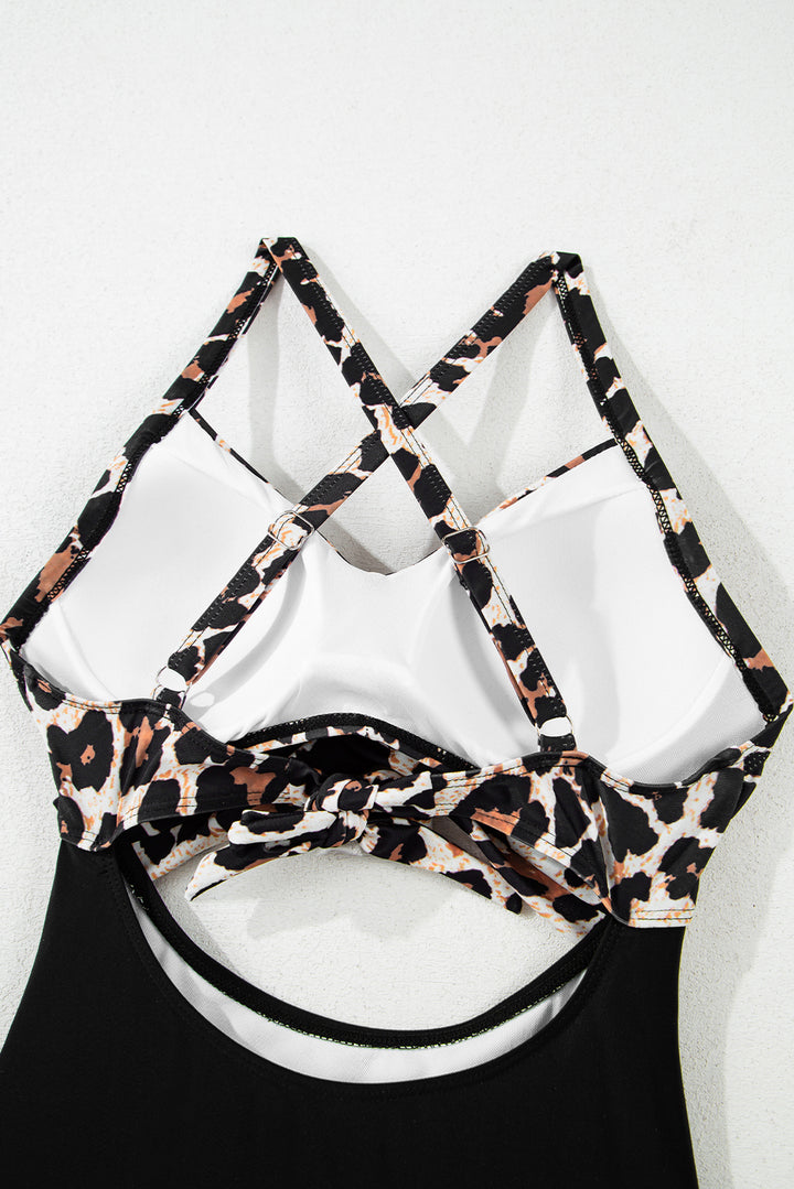 Interior view of Black Leopard 2-tone Monokini top with padded cups and crisscross straps, designed for support and style.