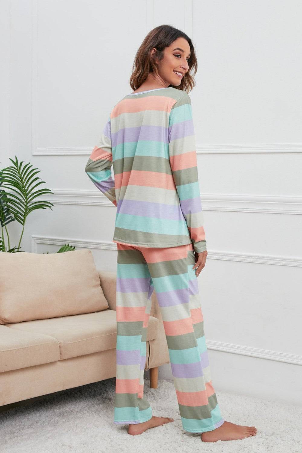 a woman wearing a colorful striped pajama set