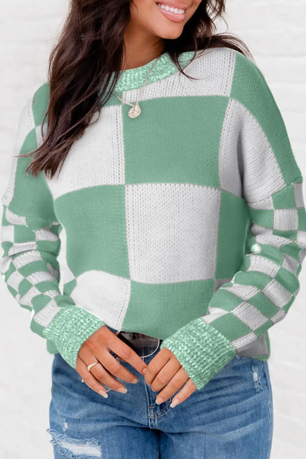 a woman wearing a green and white checkered sweater