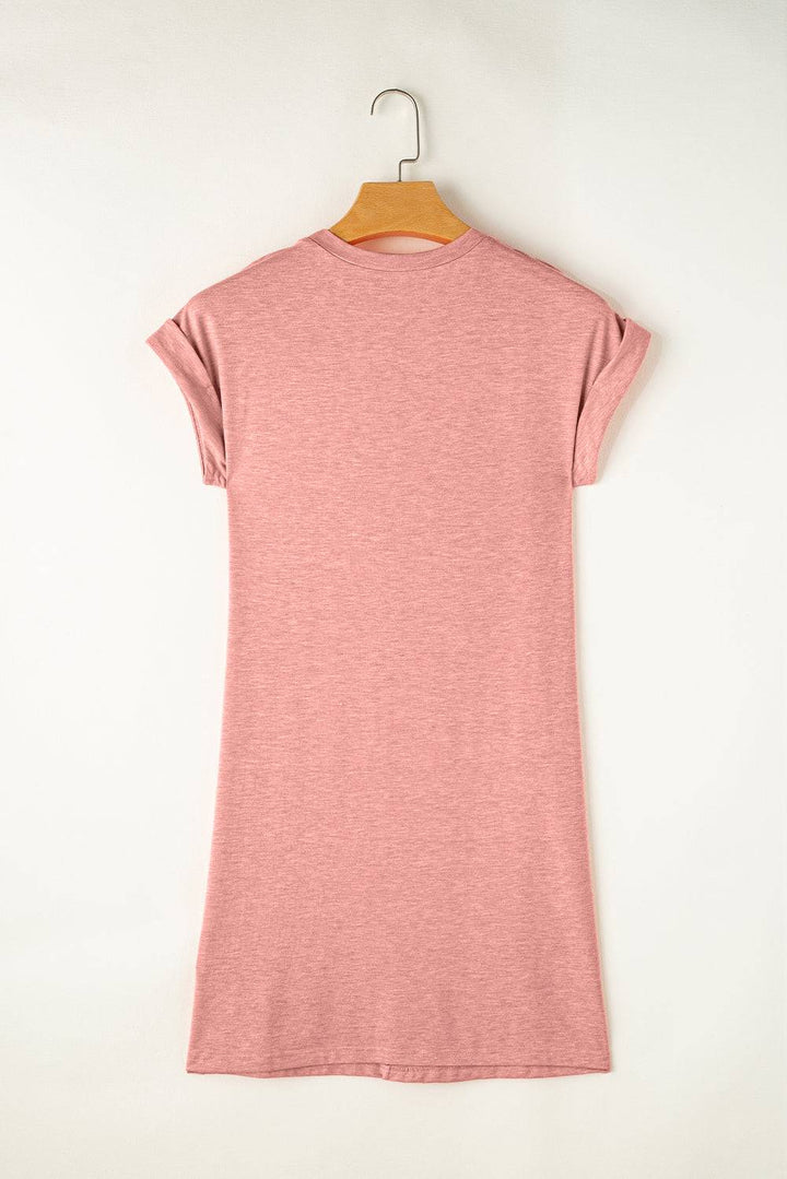 a pink t - shirt hanging on a hanger