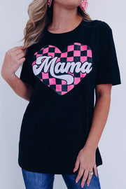 a woman wearing a black shirt with a pink heart