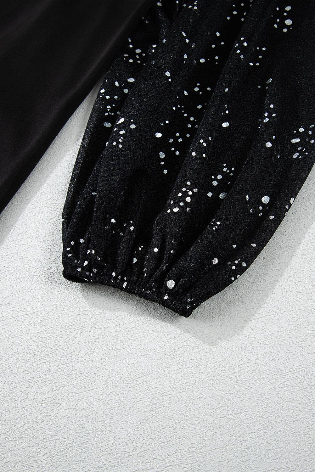 a pair of black pants with white dots on them