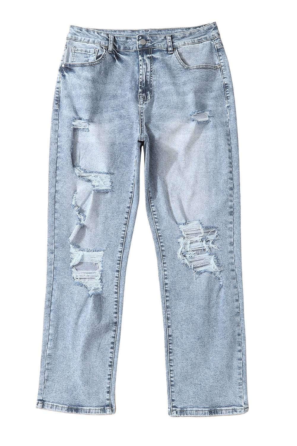 a pair of light blue jeans with holes