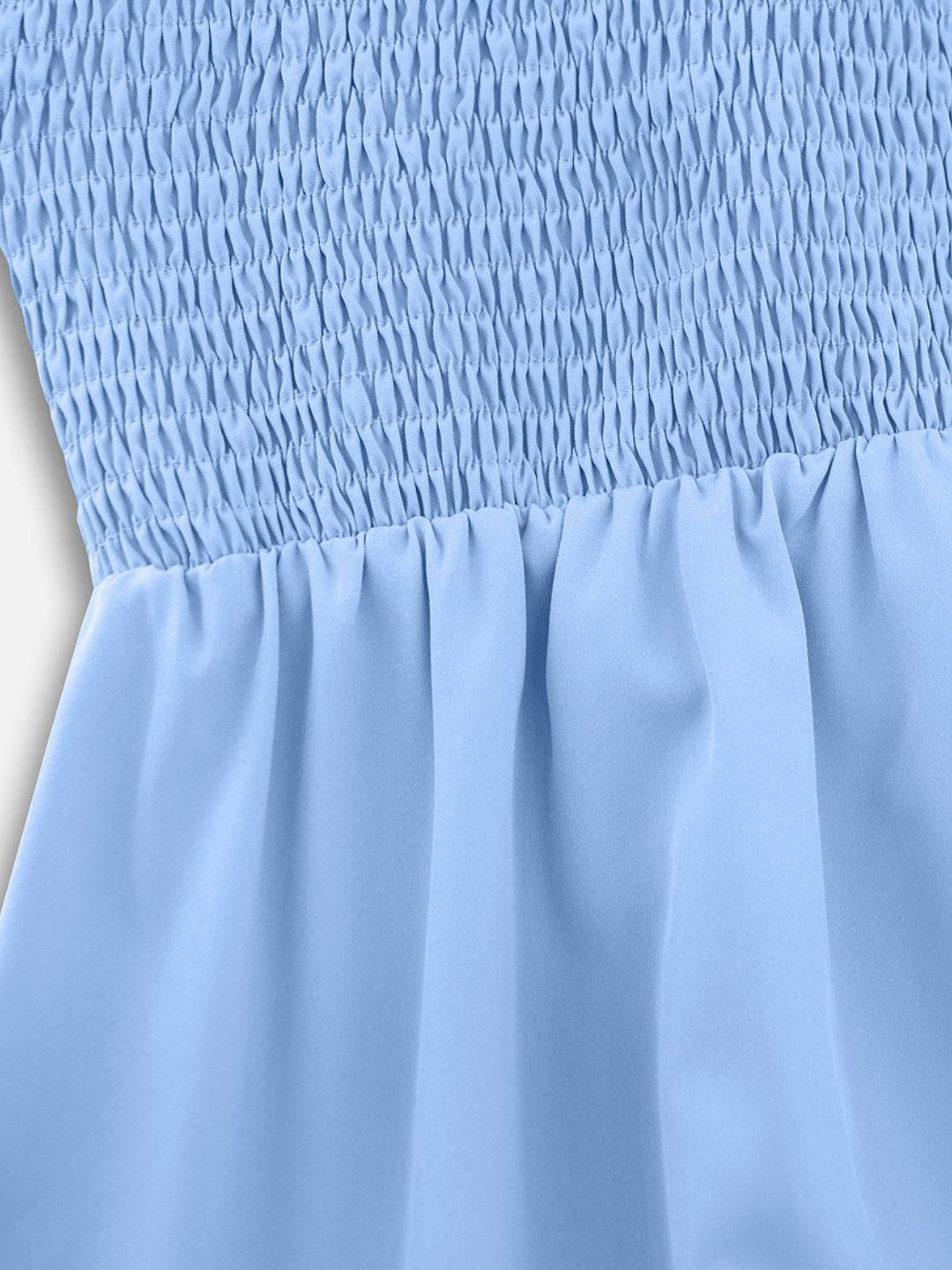 a close up of a blue dress on a white background