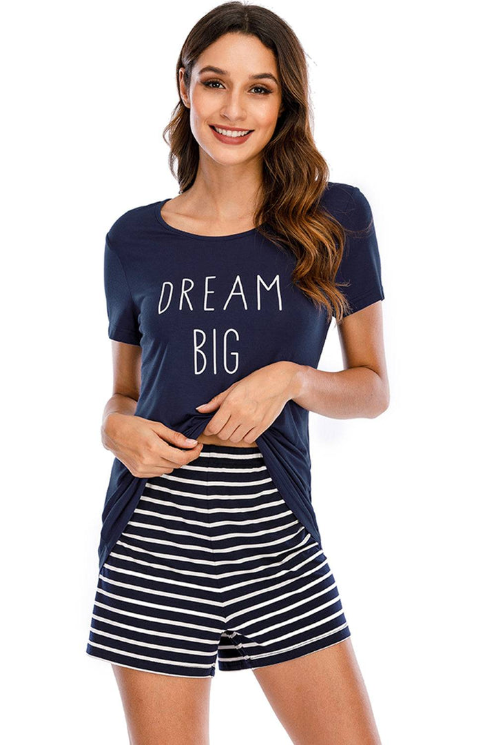 a woman wearing a t - shirt that says dream big