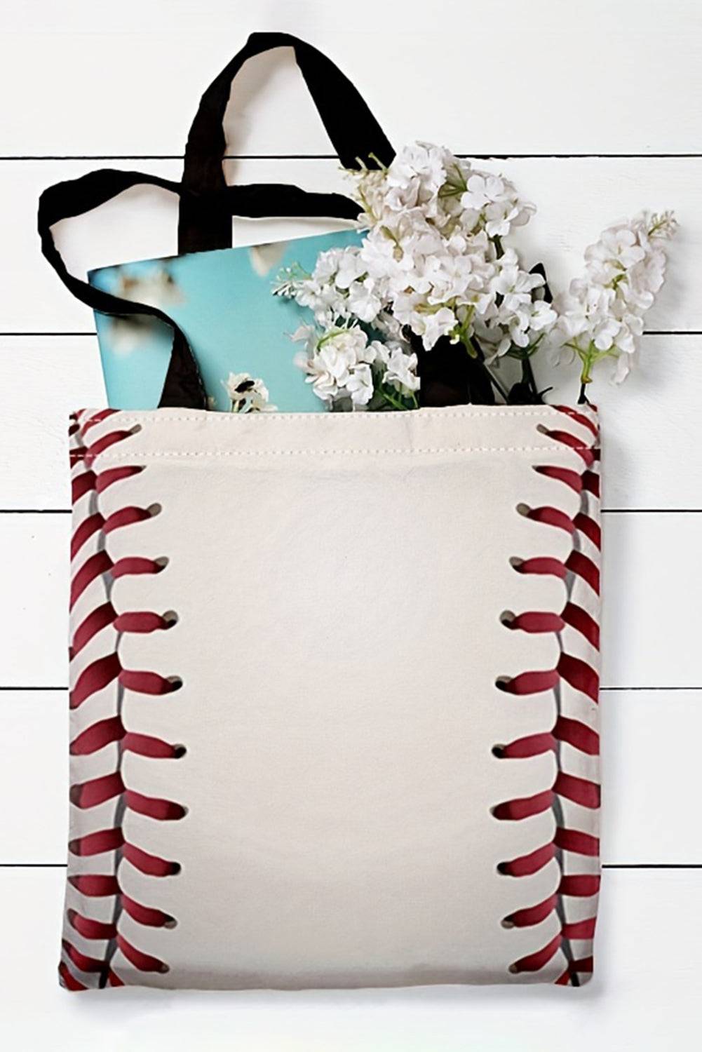 a baseball bag with flowers in it sitting on a wall