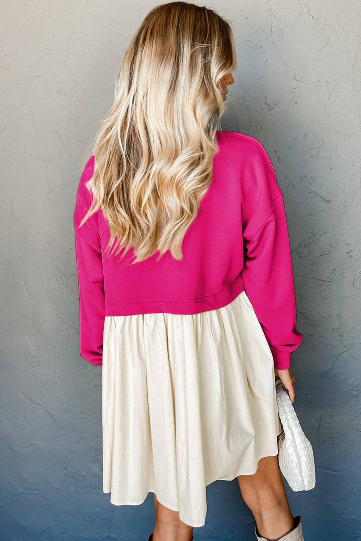 a woman in a pink sweater and white skirt