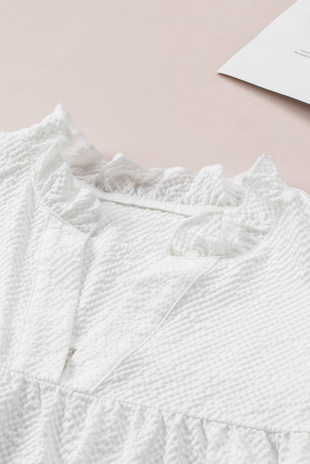 a close up of a white shirt on a table