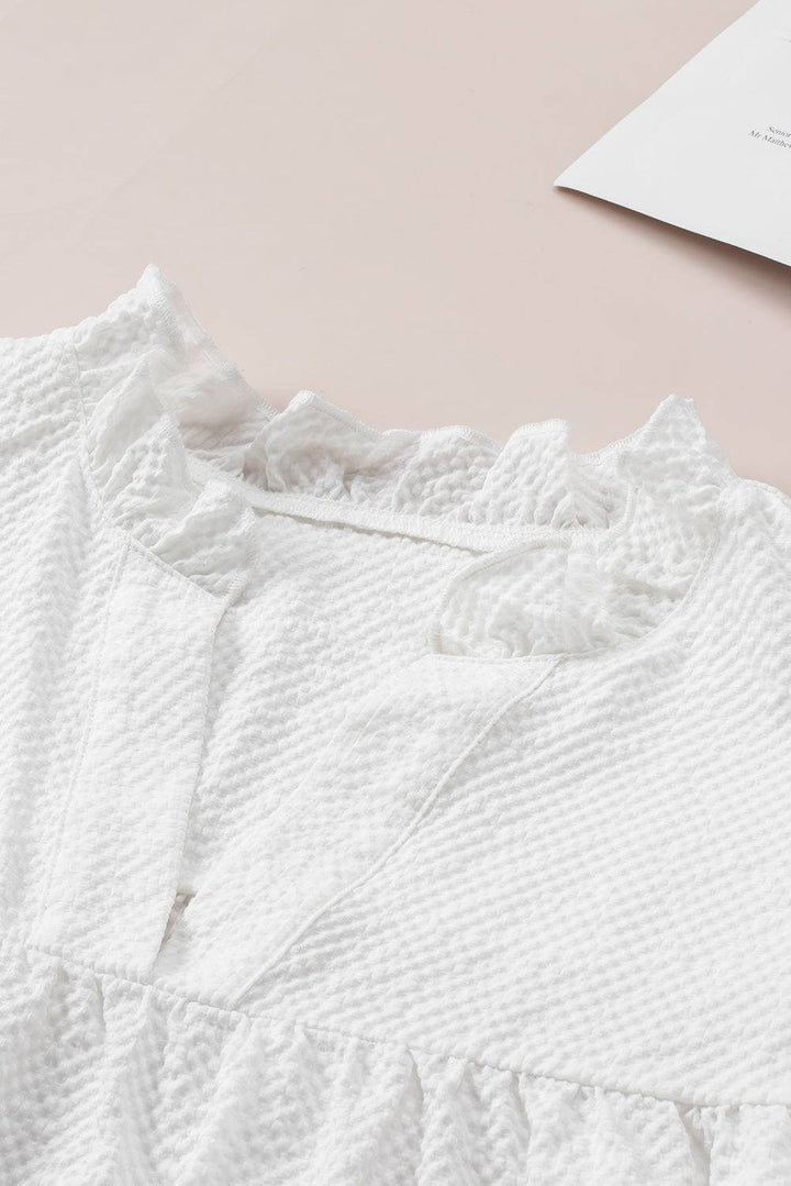 a close up of a white shirt on a table