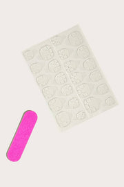 a pink sticker next to a pink pill