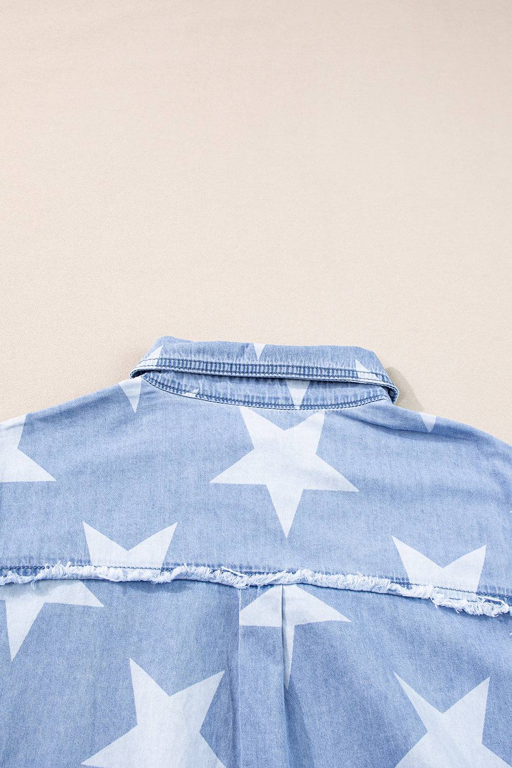 a blue shirt with white stars on it