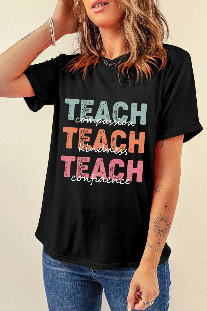 a woman wearing a black teach t - shirt