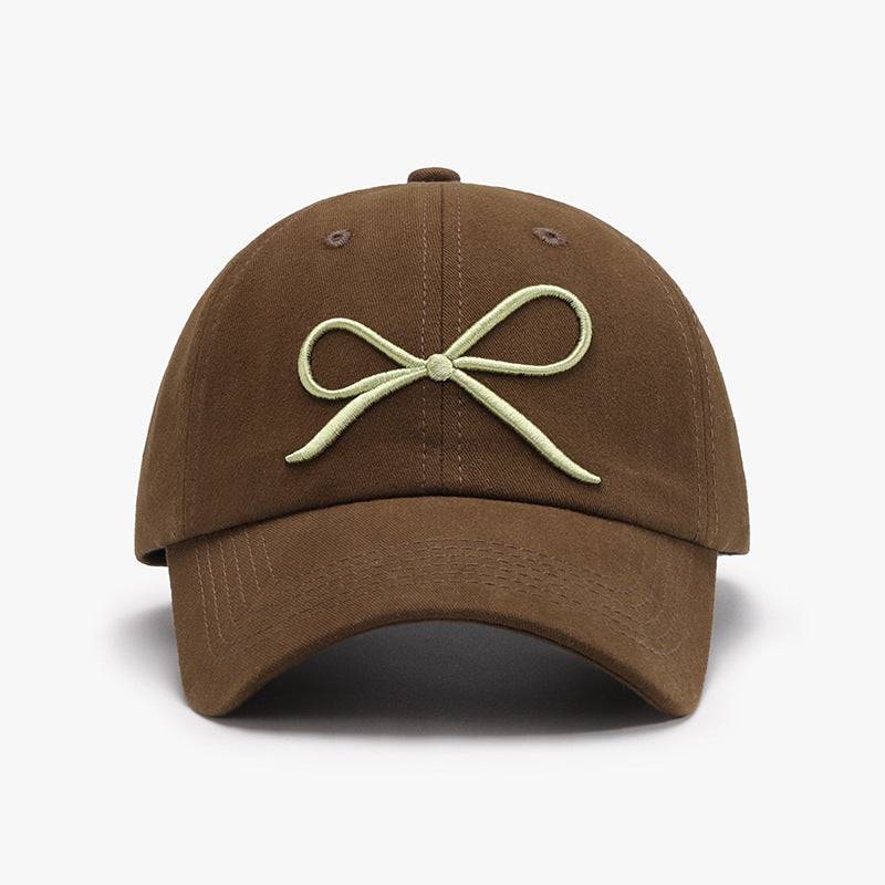 a brown hat with a bow on it