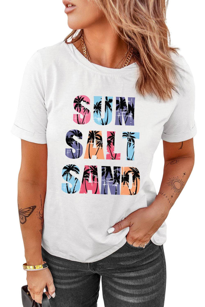 a woman wearing a white t - shirt with the words sun sand and palm trees
