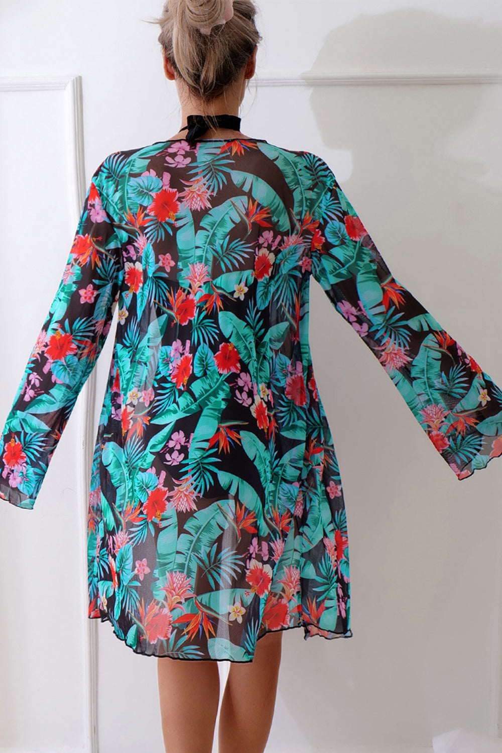 Back view of the floral beach cover up from the Black Halter Neck Monokini set, showcasing vibrant tropical print and lightweight summer fabric.