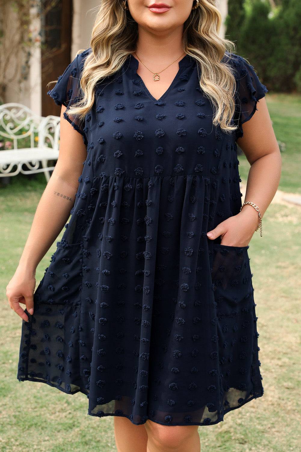 Detailed front view of Navy Blue Dotty Textured Notched Neck Plus Ruffled Dress with visible pockets and textured fabric for daily wear.