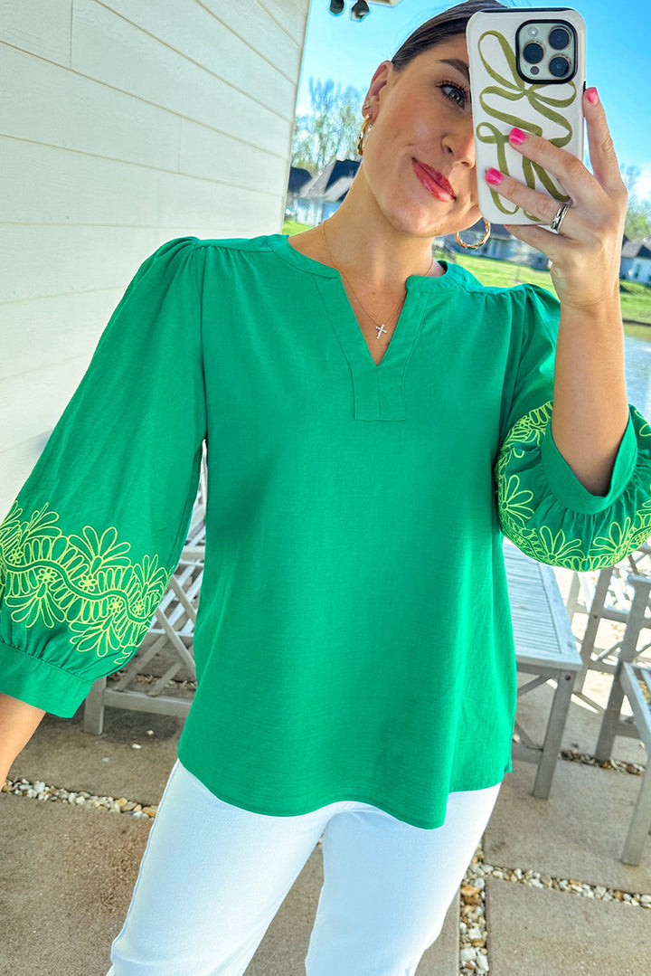 Front close-up of Green Contrast Floral Embroidered 3/4 Sleeve Notched V Neck Elegant Blouse, highlighting intricate embroidery and flattering neckline.