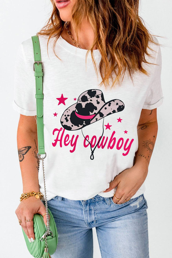 a woman wearing a tee shirt that says hey cowboy