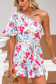 a woman in a floral romper holding a basket