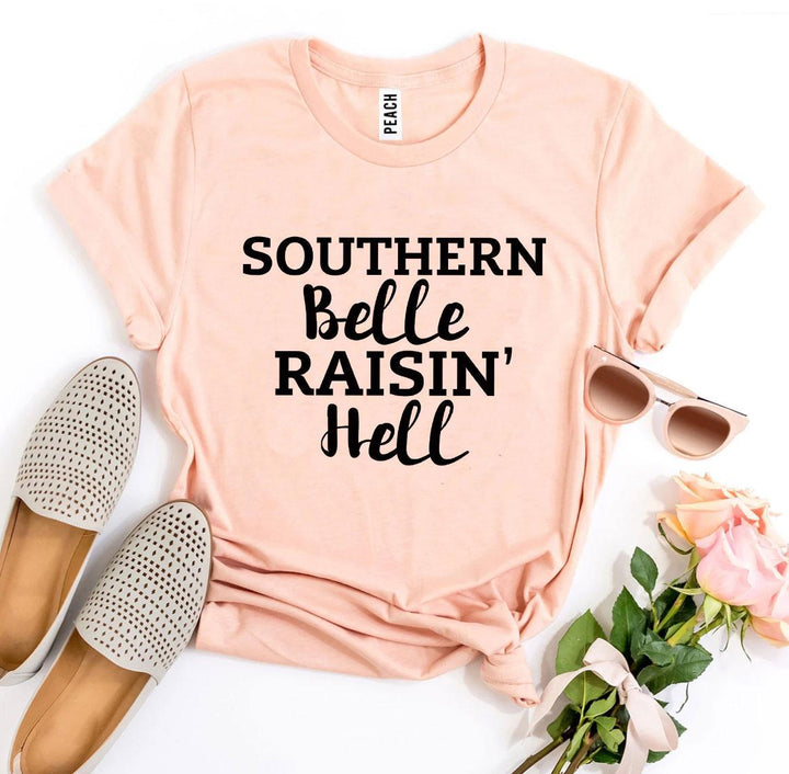 a pink shirt that says southern belle rain'hell