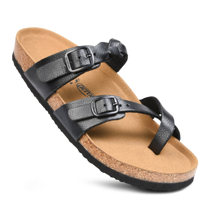 a pair of black sandals on a white background
