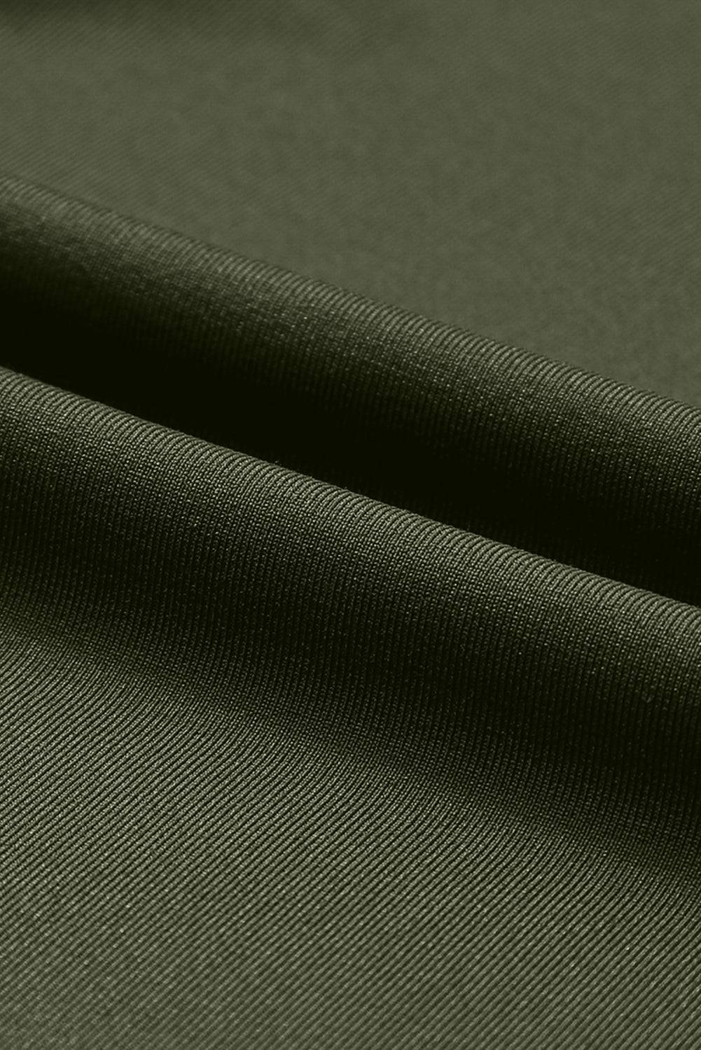 a close up view of a green fabric