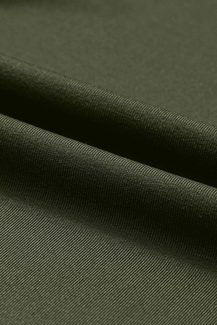 a close up view of a green fabric