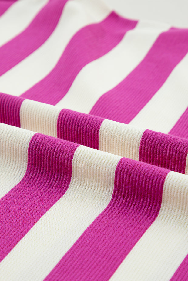 a close up of a pink and white striped fabric