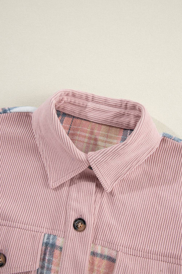 a close up of a pink shirt with a checkered collar