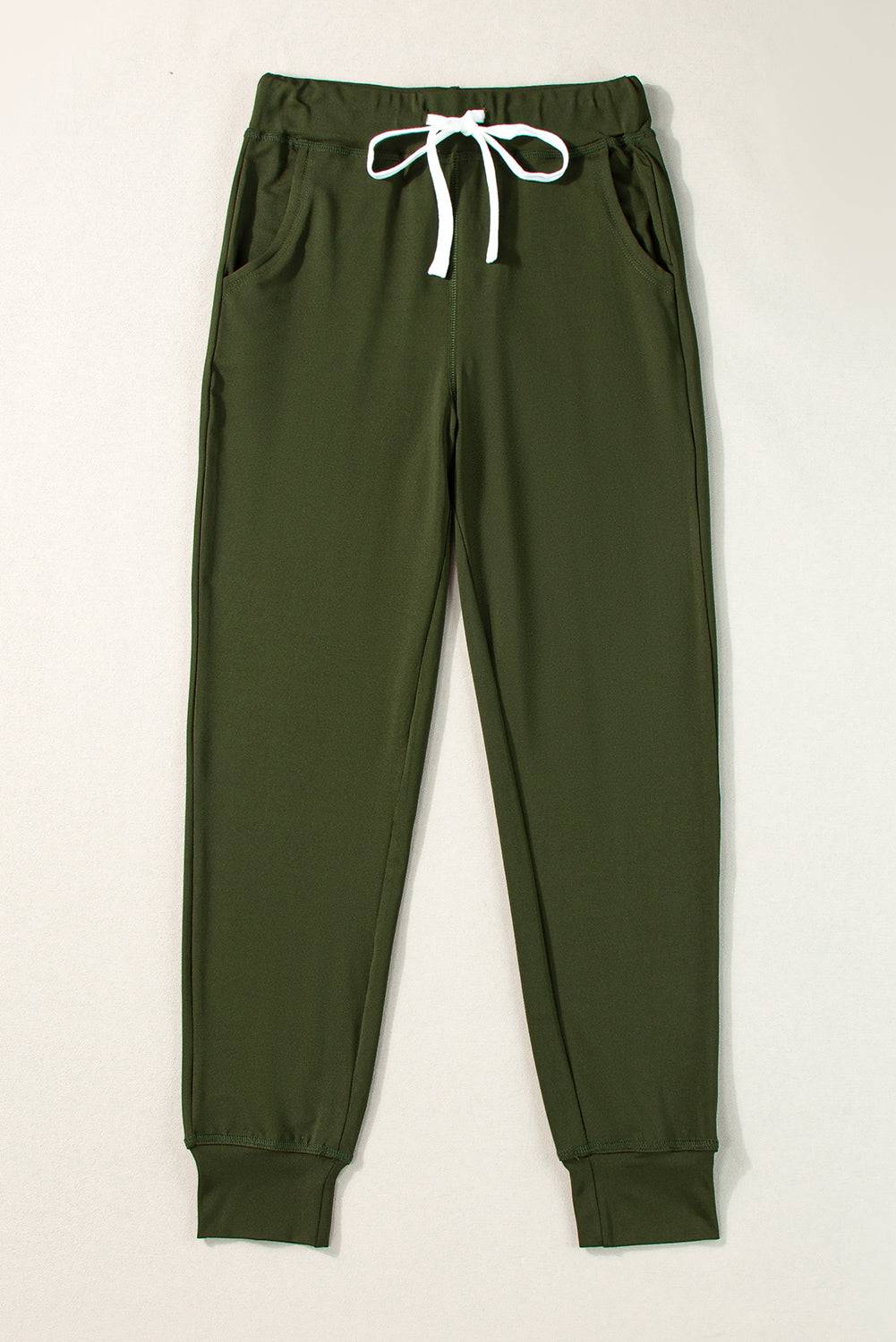 a pair of green pants with white drawstrings