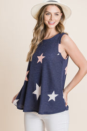 a woman wearing a blue top with stars on it