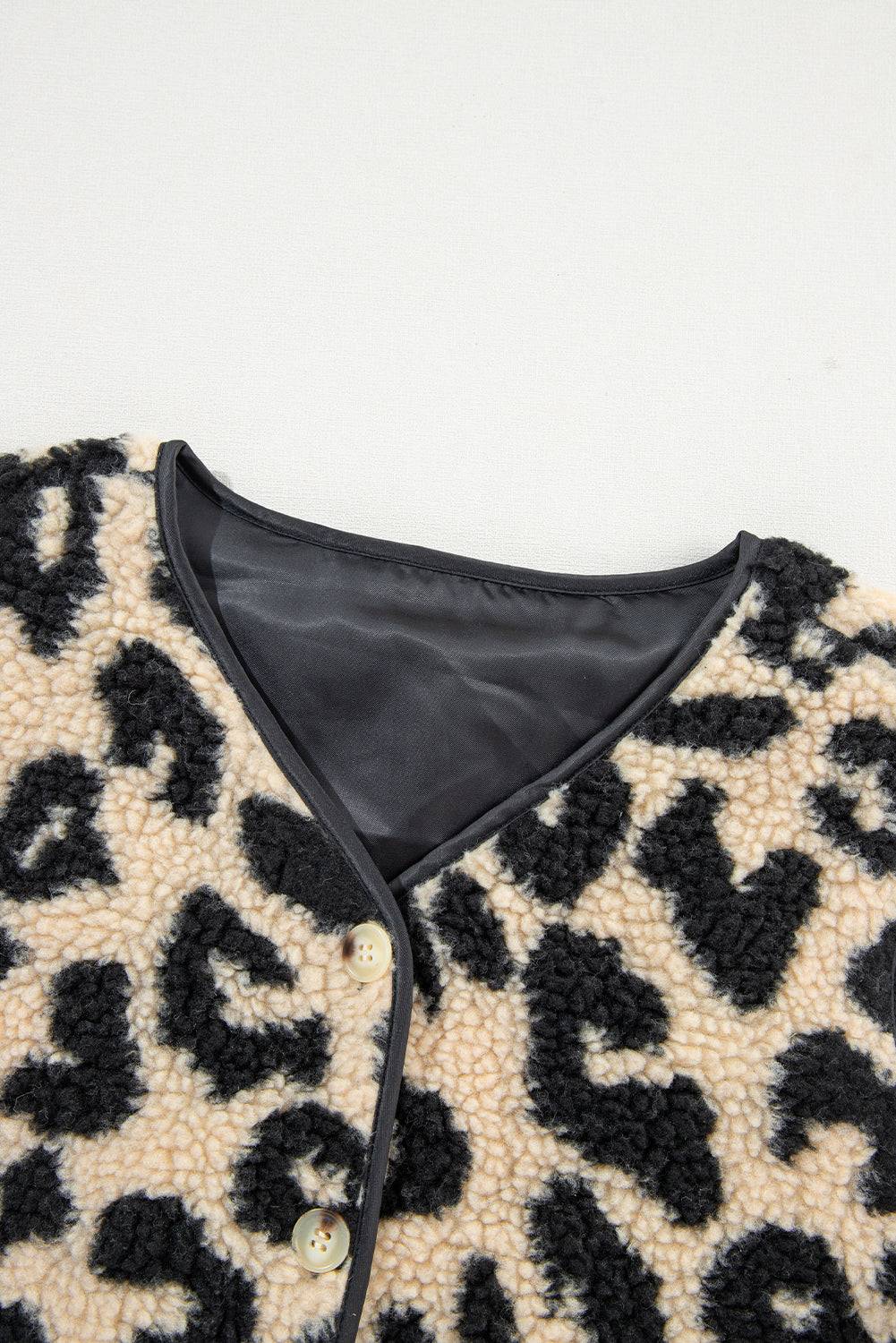 a leopard print jacket with a black leather collar