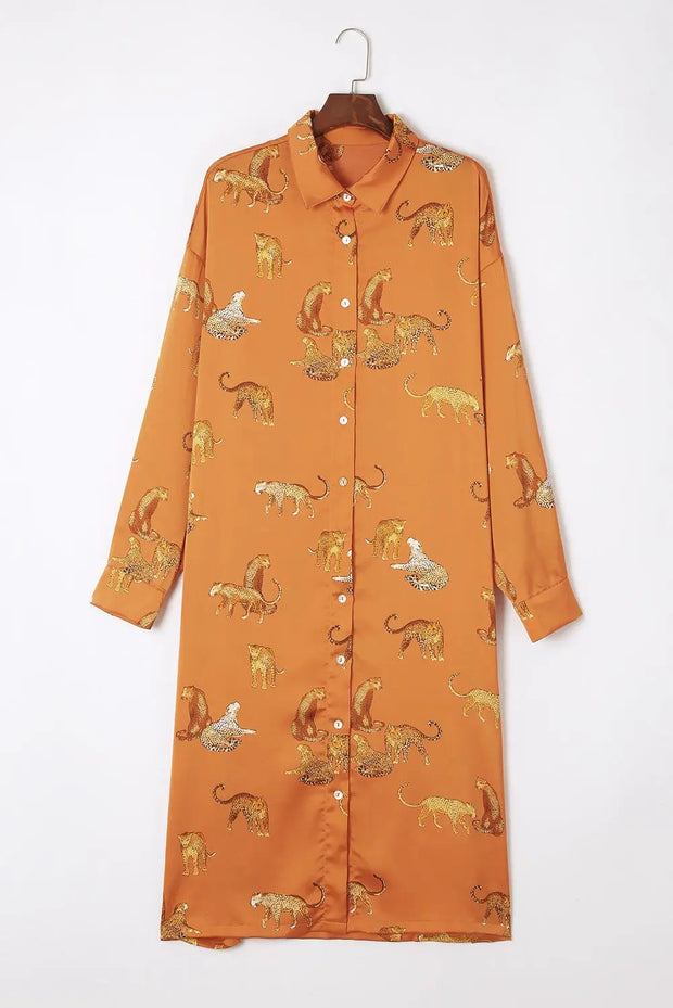 an orange shirt dress with animals on it