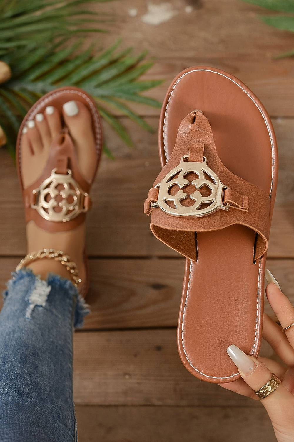 a woman's feet wearing a pair of sandals