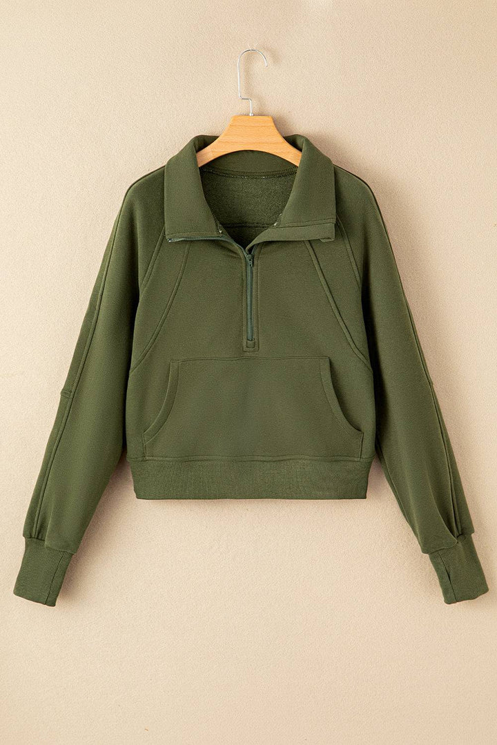 a green jacket hanging on a wall