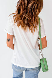 a woman in a white shirt is holding a green purse