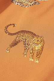 a close up of a shirt with a picture of a cheetah on it