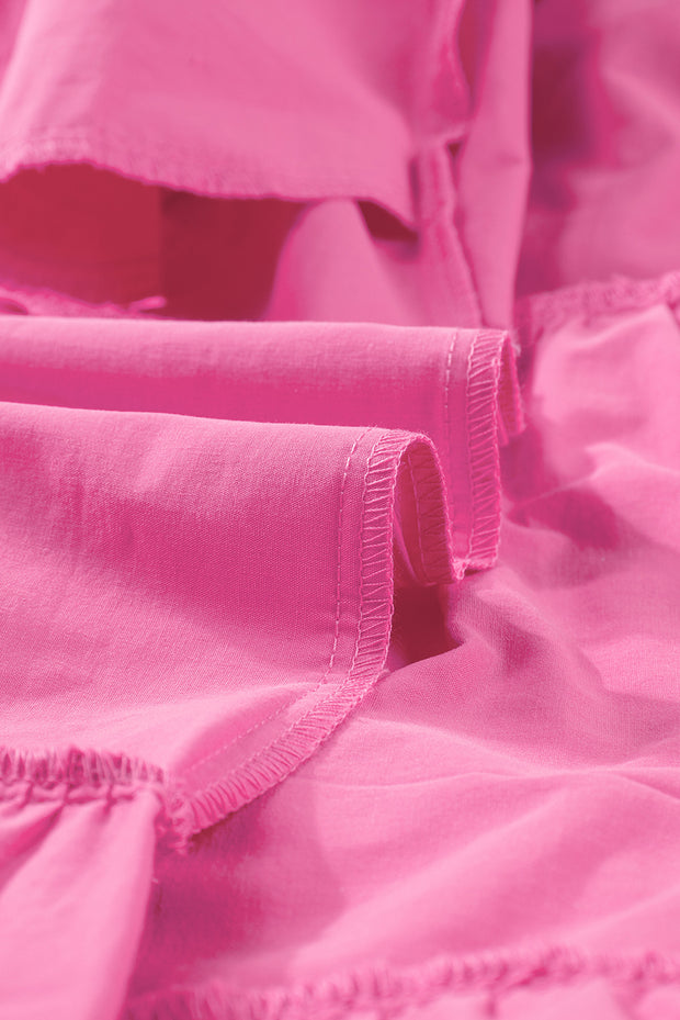 a close up of a pink cloth with ruffles